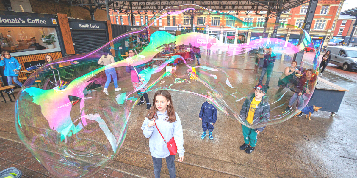 Children with bubbles at Preston Market Children with bubbles at Preston Market
